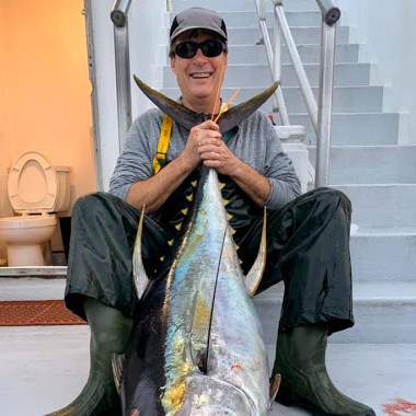 a person holding a fish