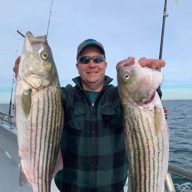 a person holding a fish