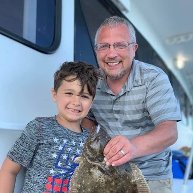 Eli Tokash holding a fish