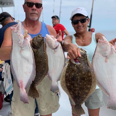 a man holding a fish