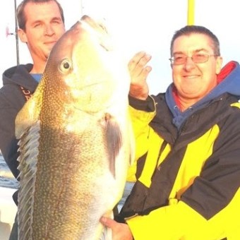 a person holding a fish