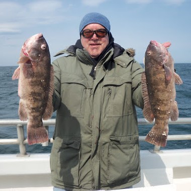 a person holding a fish