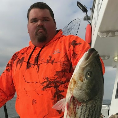 a man holding a fish