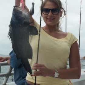 a person holding a fish