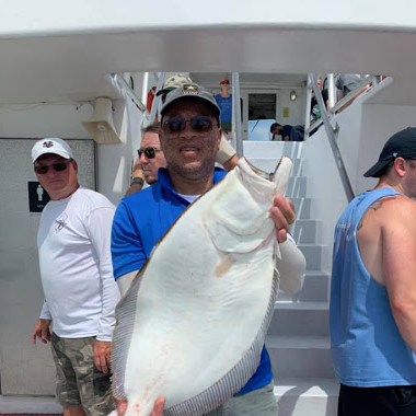 a person holding a fish