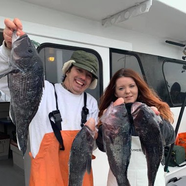 a person holding a fish