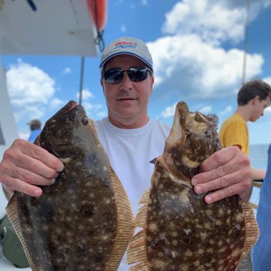 a person holding a fish