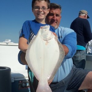 a man holding a fish