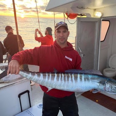 a man holding a fish