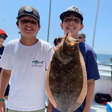 a man holding a fish