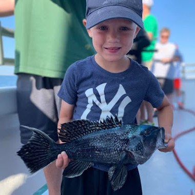 a little boy wearing a hat