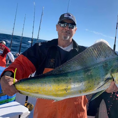 a man holding a fish