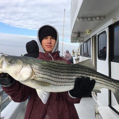 a person holding a fish