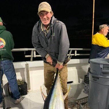 a person holding a fish