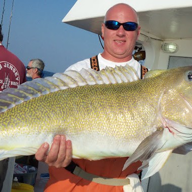 a person holding a fish