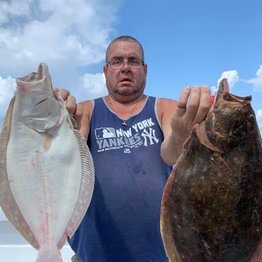 a man holding a fish