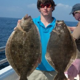 a man holding a fish