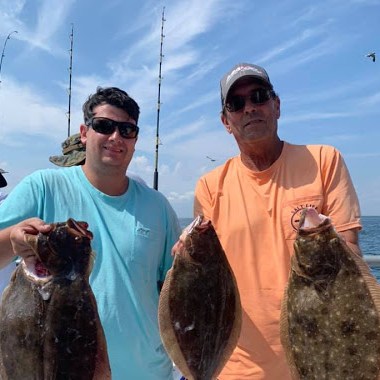 a man holding a fish