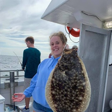 a person holding a fish