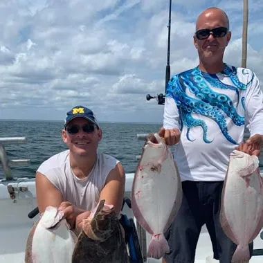 a person holding a fish