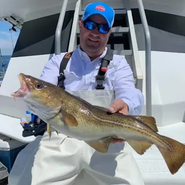 a man holding a fish