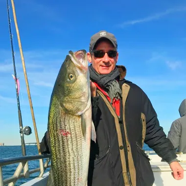 a person holding a fish