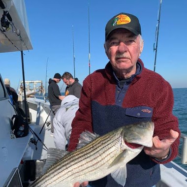 a person holding a fish