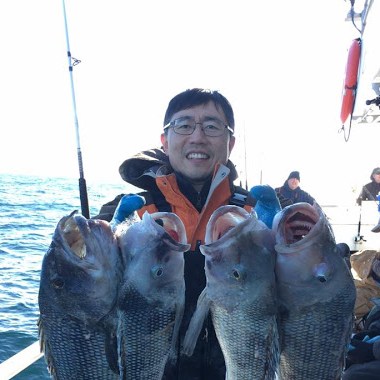 a person holding a fish