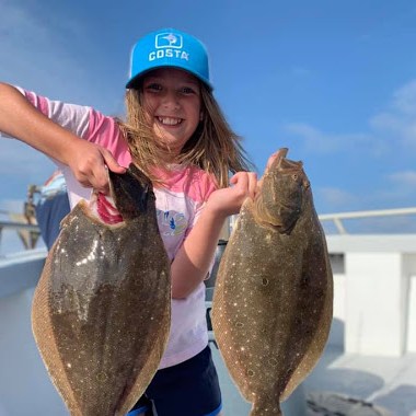 a person holding a fish