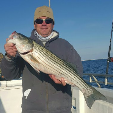 a man holding a fish