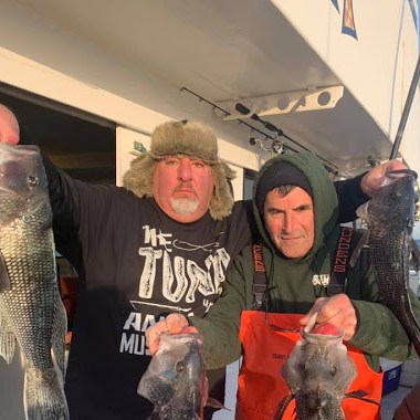 a man holding a fish