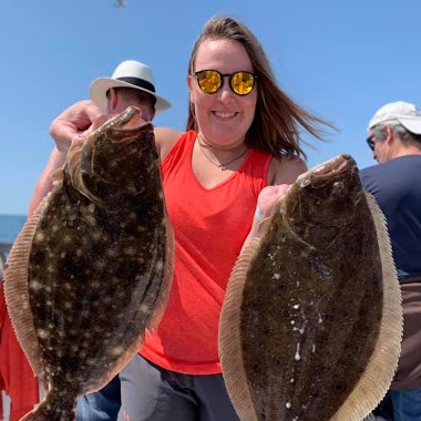 a person holding a fish