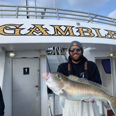a man holding a fish
