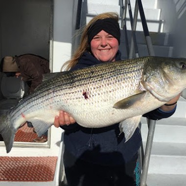 a person holding a fish