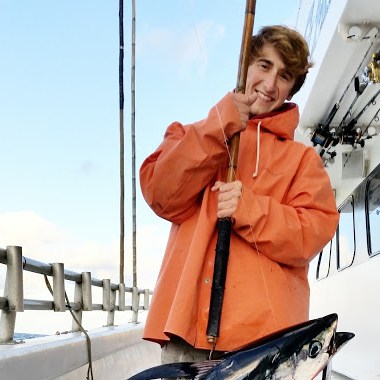a person standing in front of a boat