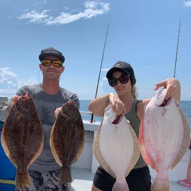 a person holding a fish