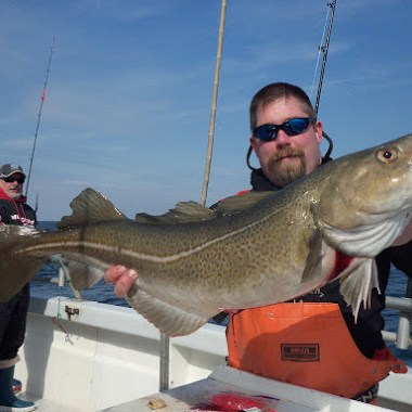 a man holding a fish