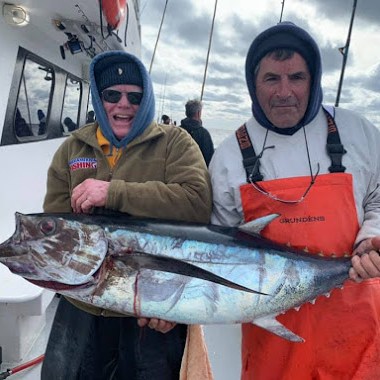 a person holding a fish