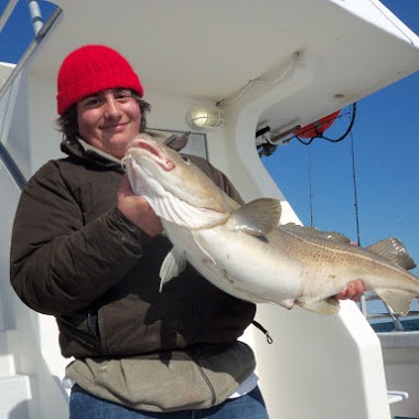 a person holding a fish