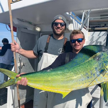 a man holding a fish