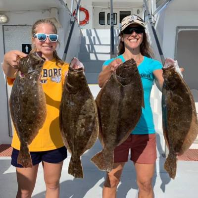 a person holding a fish