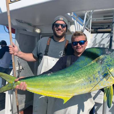 a person holding a fish