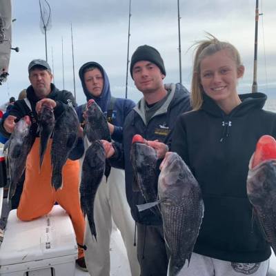 a person holding a fish