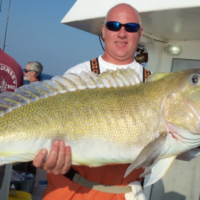 a person holding a fish