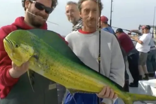 a man holding a fish