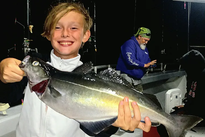 a person holding a fish